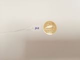 a gold coin with the number 22 on it