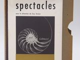 an open book with a picture of a spiral design on it
