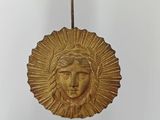 a clock that has a face on it on a stand