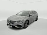 a grey car in a white room with a white background