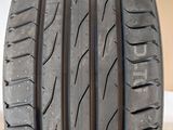 a close up of a car tire on a stand in a garage