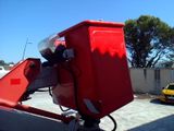 a large red box sitting on top of a trailer