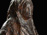 a statue of a woman with a veil on it ' s head