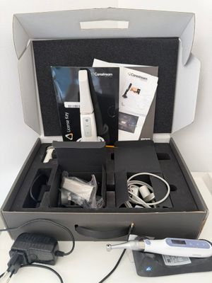 a box with a remote and other items in it