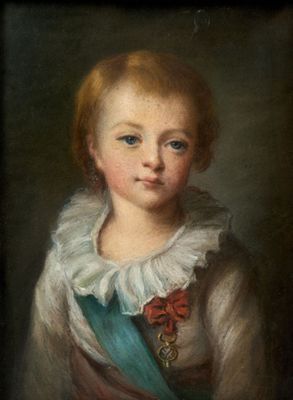 portrait of a young boy in a blue and white dress