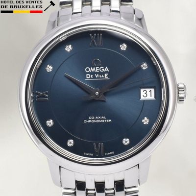 an image of a close up of a wrist watch with a blue dial
