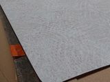 a large sheet of paper sitting on top of a cardboard box