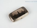 a silver case with a picture of a city on it