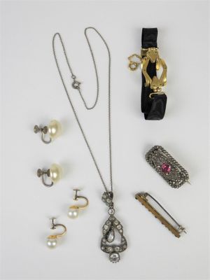 a group of jewelry including a necklace, bracelet, and ring