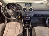 the interior of a car with a steering wheel and dashboard controls