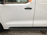 a white van with a dog sticking its head out the window