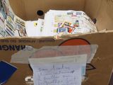 a cardboard box that has a bunch of papers in it