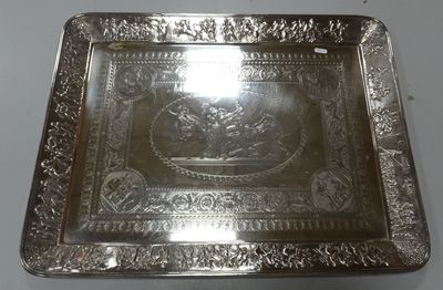a silver plate with a picture of a man on a horse