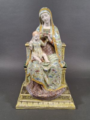 an image of a statue of a woman holding a child