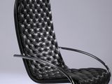 an image of a black leather chair with a chrome base