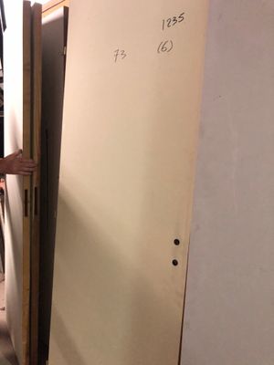 a man that is standing in front of a refrigerator