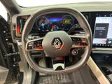 the interior of a car with a steering wheel and dashboard controls