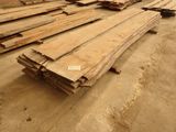 several pieces of wood are stacked on the floor in a warehouse