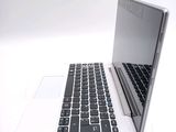 a laptop computer sitting on top of a white table