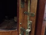 a close up of a wooden door with a latch on it