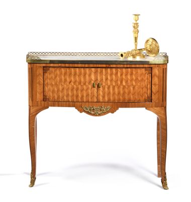 a small table with a drawer and a candle on it