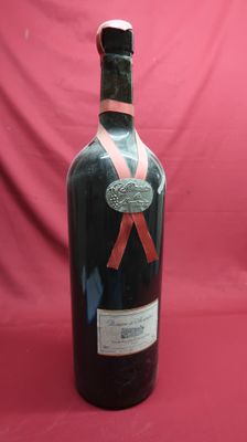 a bottle of wine with a red ribbon on it