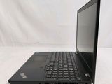 the laptop is open on a white surface with a white background