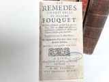 a book that is sitting on a table next to some books