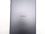 a close up of the back of a tablet computer on a white surface