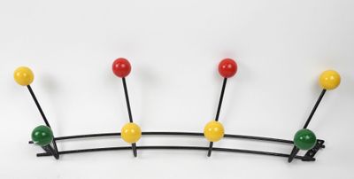 a coat rack that has a bunch of colorful balls on it