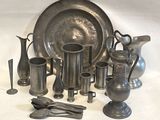 a lot of silver items that are on the table