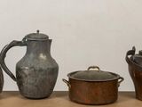 four different types of teapots on a table