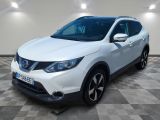 a white nissan qx suv parked in a garage