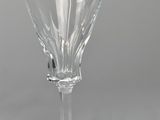 an empty wine glass sitting on top of a table