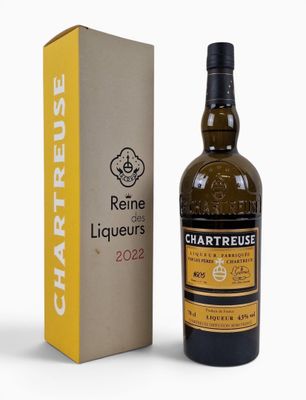 a bottle of wine next to a cardboard box