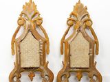 pair of antique carved wood chairs with upholstered back cushions