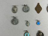 a lot of different types of charms on the table