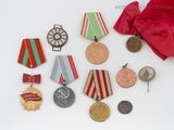 some medals and medals are laying out on a white surface