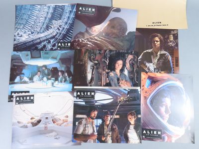 a lot of star wars movie posters on a table
