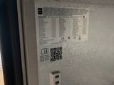 a close up of a freezer door with a qr code on it