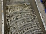 a metal basket that has a bunch of wire inside of it