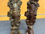 pair of antique bronze figurines of a woman and a man