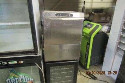 two refrigerators that are sitting next to each other in a room