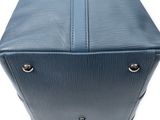 a close up of a blue suitcase on a white background