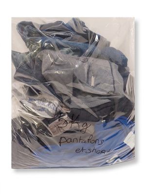 a bag full of clothes that is wrapped in plastic