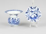 a blue and white vase and a blue and white bowl