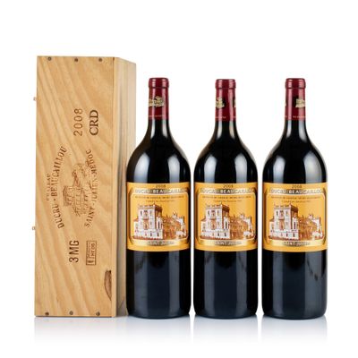 three bottles of red wine in a wooden box next to a wooden box