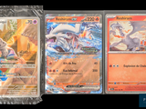 several pokemon cards are lined up in plastic bags on a black background