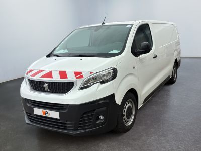 the white van is parked in a large room with a red stripe on the side