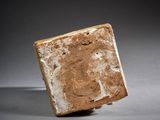an image of a stone block on a gray surface
